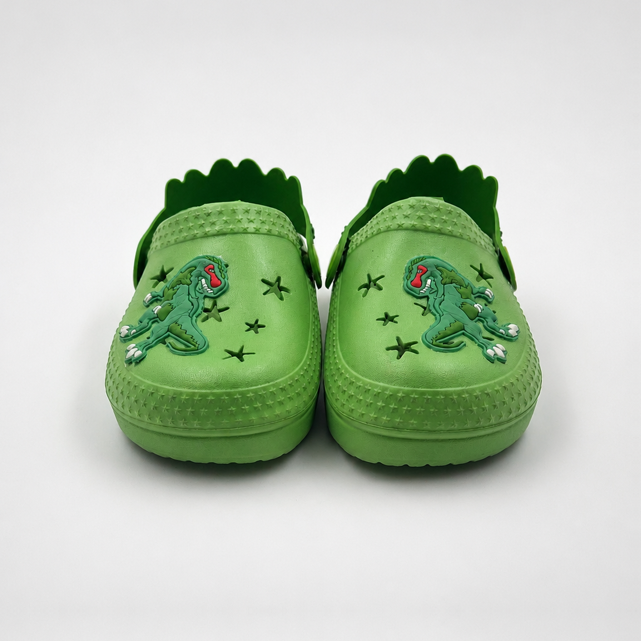 Fabricante al por mayor de los zapatos de jardín de EVA de los zuecos de los niños del dinosaurio verde
