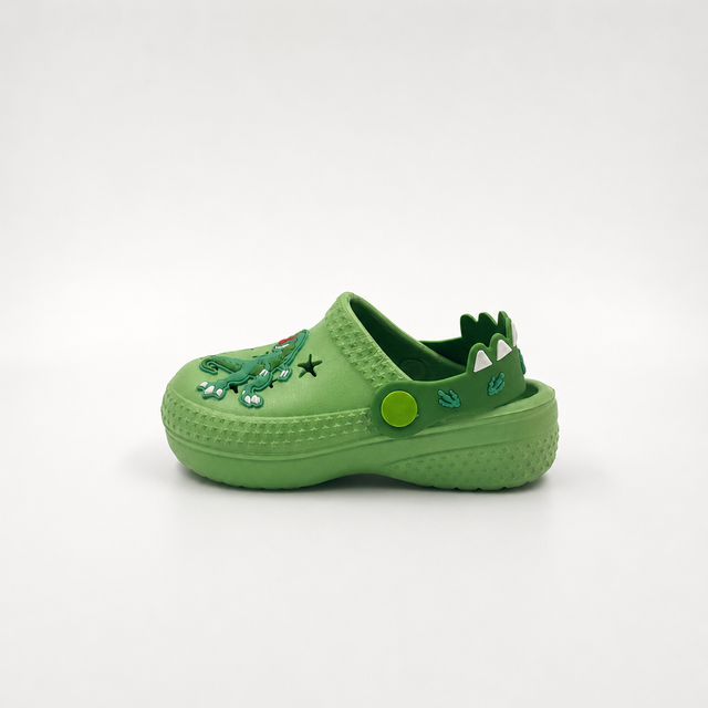 Fabricante al por mayor de los zapatos de jardín de EVA de los zuecos de los niños del dinosaurio verde