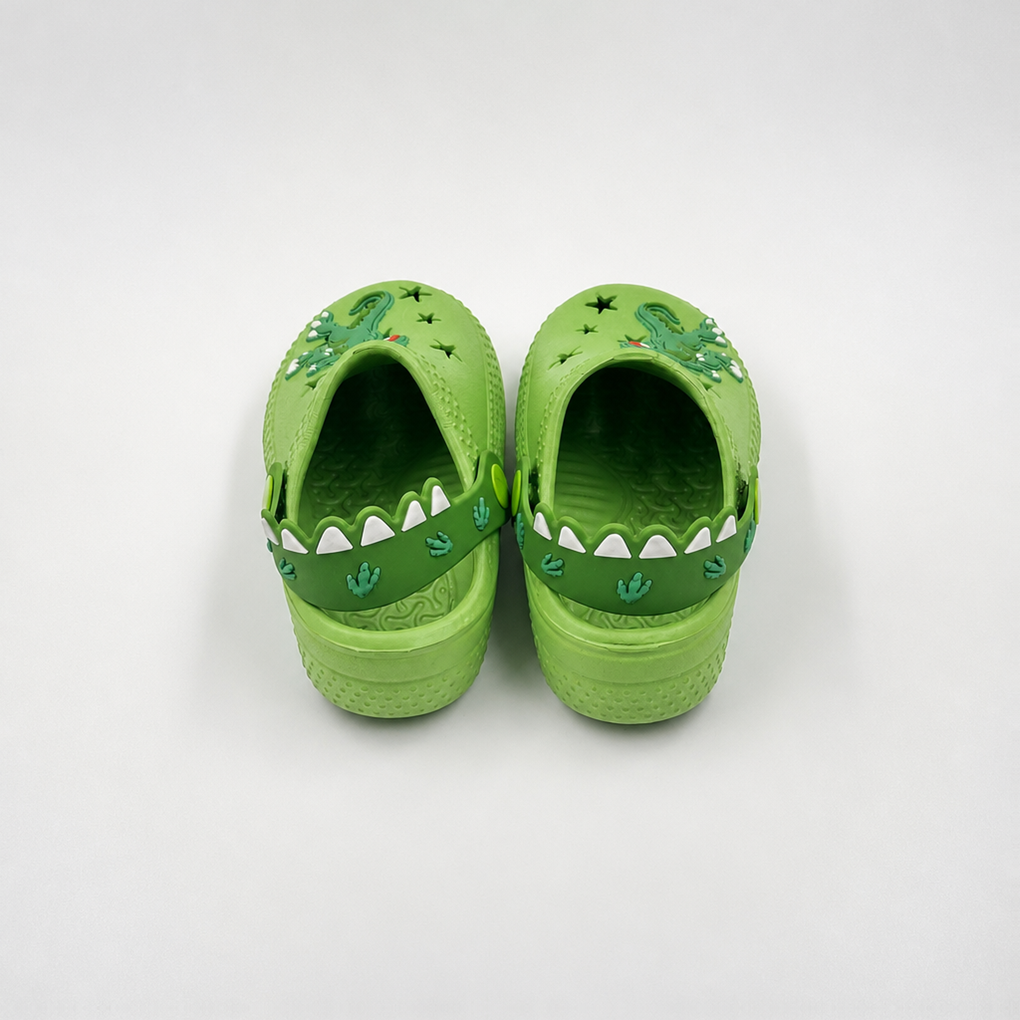 Fabricante al por mayor de los zapatos de jardín de EVA de los zuecos de los niños del dinosaurio verde
