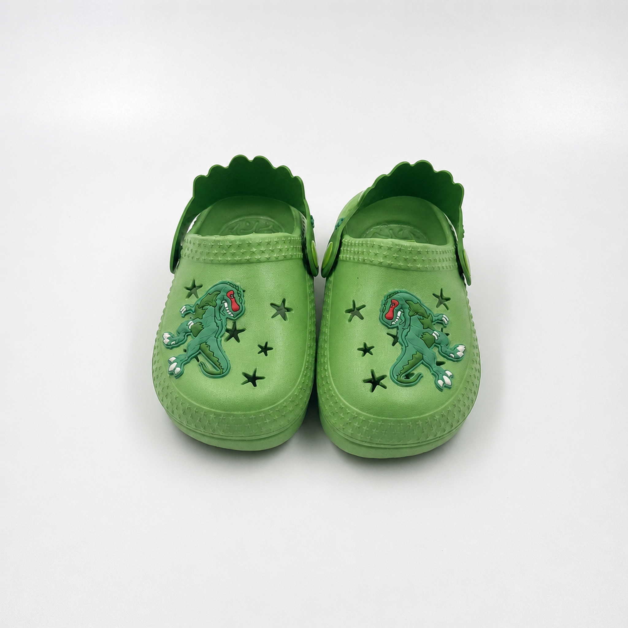 Fabricante al por mayor de los zapatos de jardín de EVA de los zuecos de los niños del dinosaurio verde